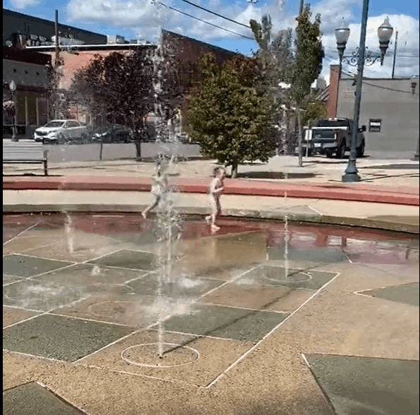 running through the splash pad