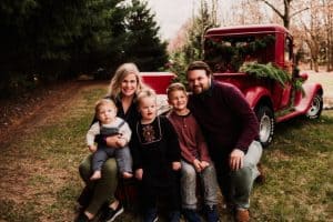 Marshall family in front of a red truck