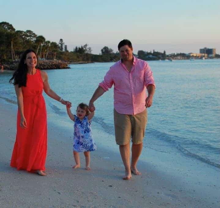 Laura Sargent and family walking on the beach