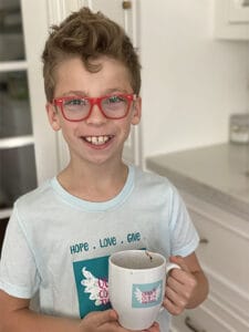 Quinn Pruitt holding a cup of cocoa